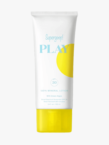 Supergoop Play 100% Mineral Lotion SPF 30 with Green Algae white tube with yellow dot and cap on light gray background
